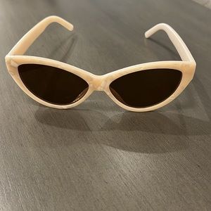 Mother of pearl look sunglasses. There is no brand name on them. Not ASOS brand